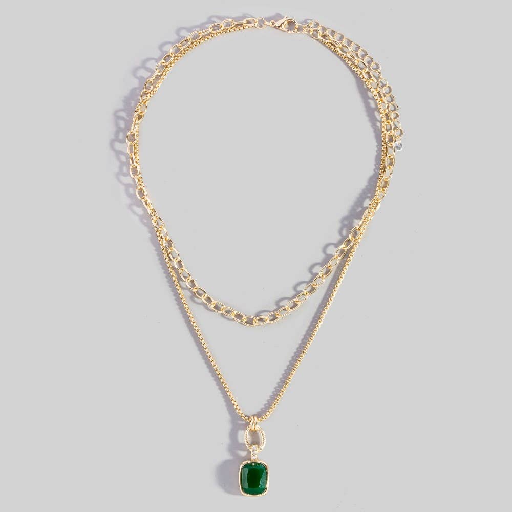 Doodlations Coffee Bar & Boutique gold-tone layered necklace with a chunky link chain and green cushion-cut pendant.