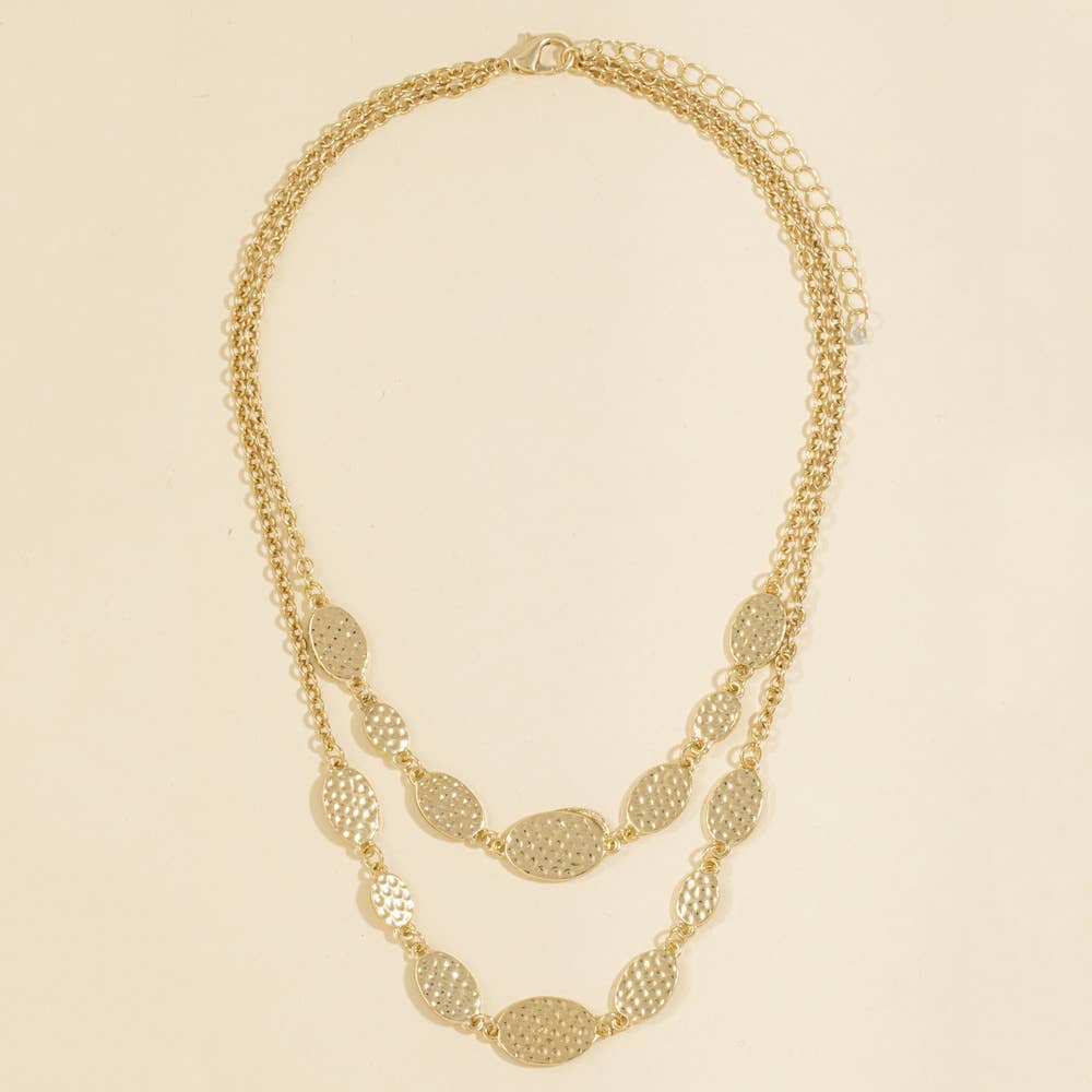 Doodlations Coffee Bar & Boutique gold-tone layered necklace with hammered oval stations and adjustable chain