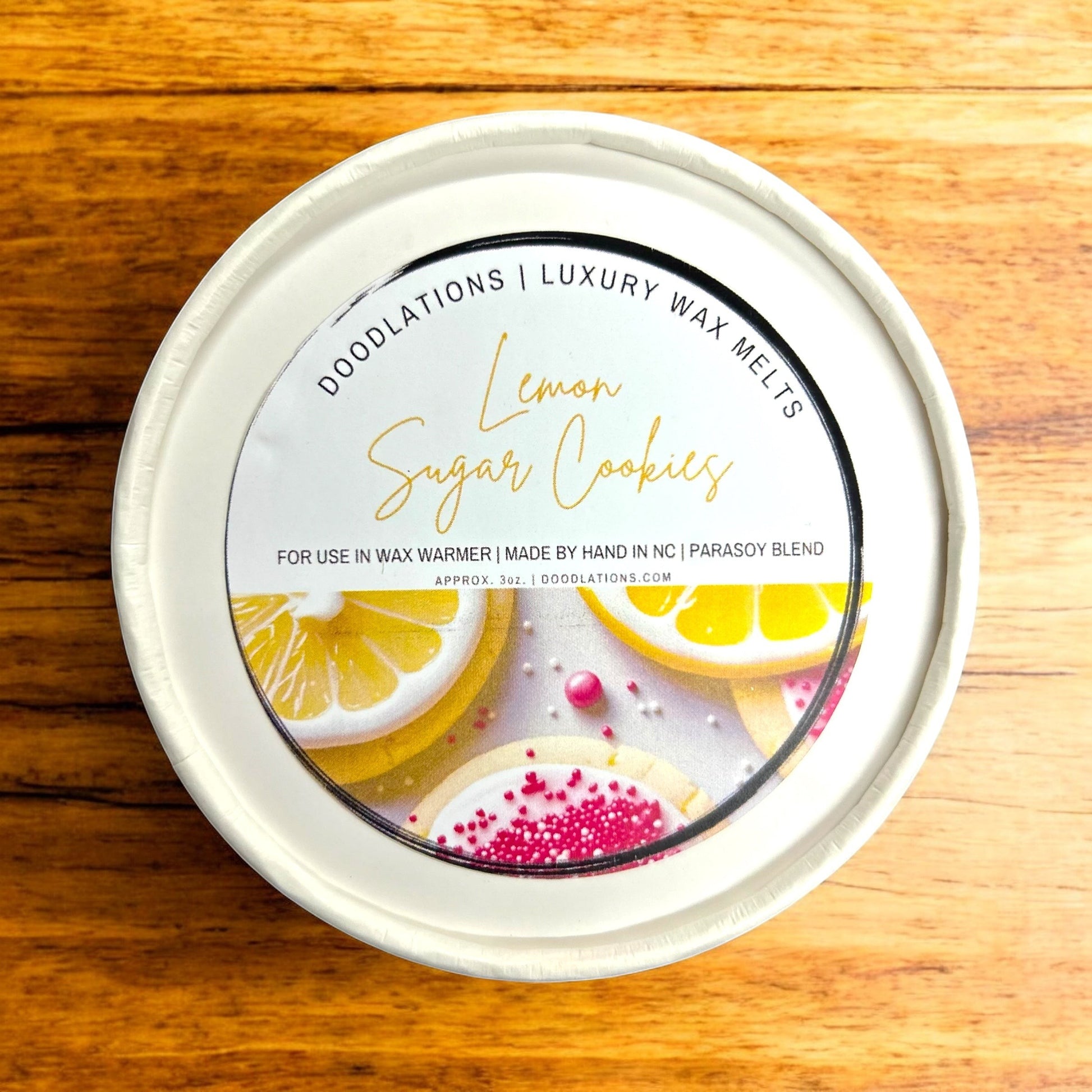 Doodlations Luxury Wax Melts in Lemon Sugar Cookies scent, featuring realistic lemon slices and decorated sugar cookies.