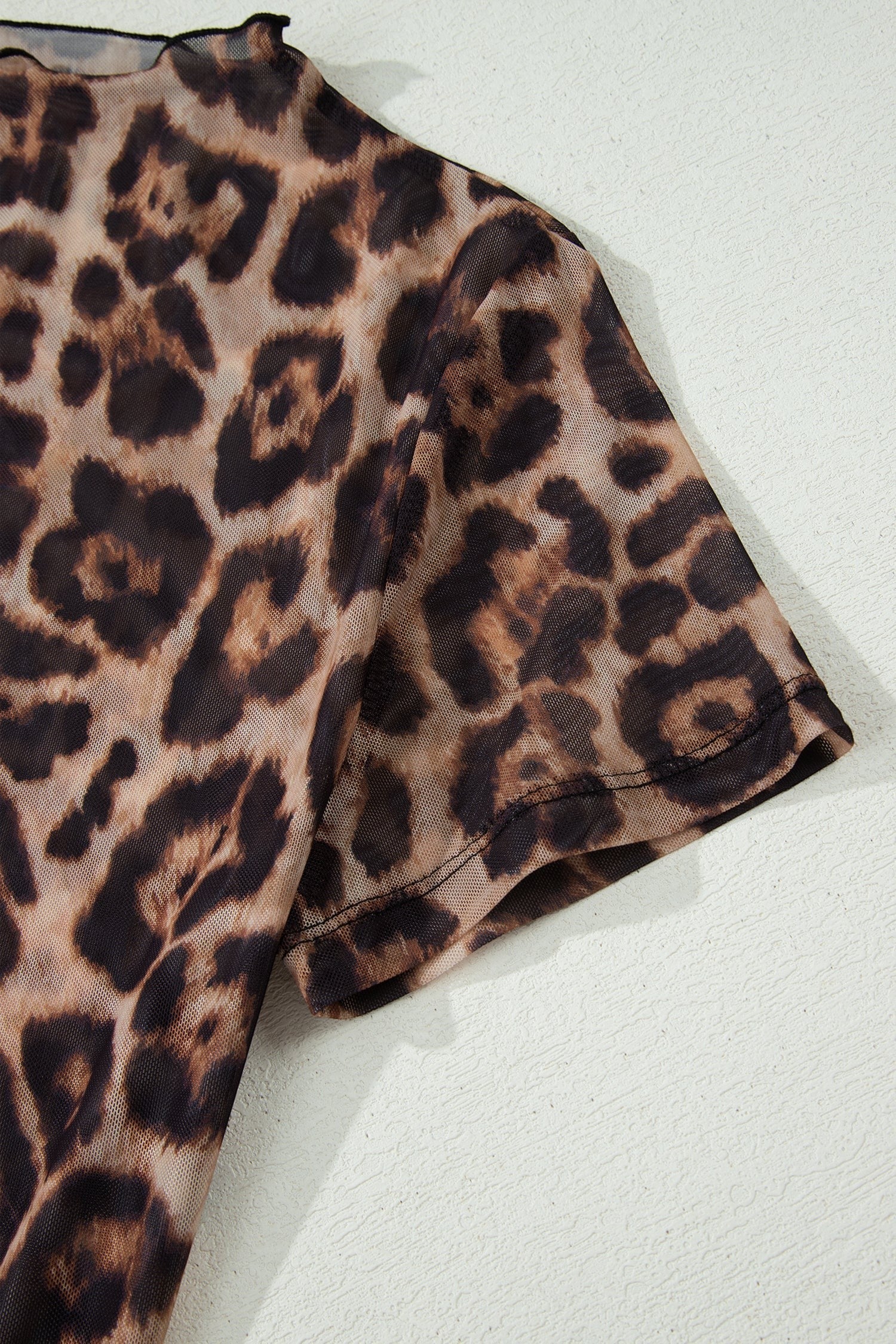 Doodlations Coffee Bar & Boutique leopard print short sleeve mesh top with lettuce edge hem
