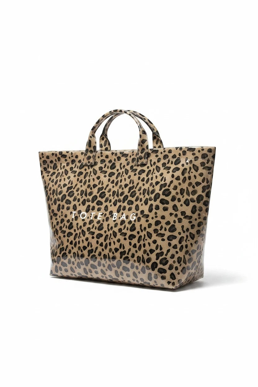 Doodlations Coffee Bar & Boutique leopard print tote bag with a glossy PVC finish and white text detail.