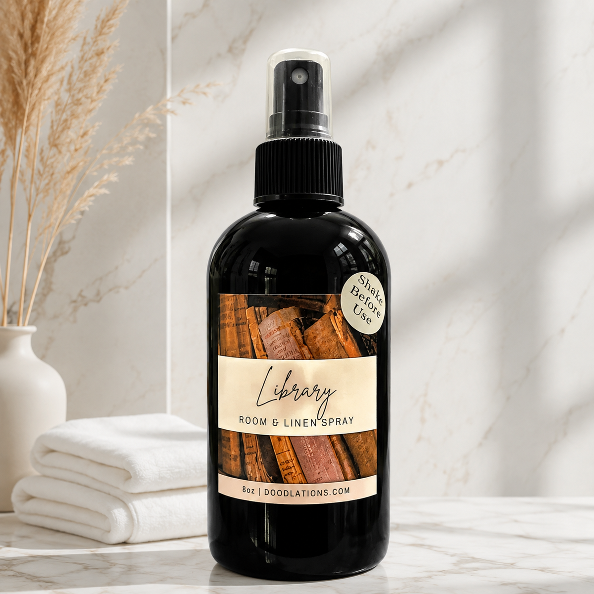 Doodlations Coffee Bar & Boutique Library room and linen spray in a black bottle with a vintage book label