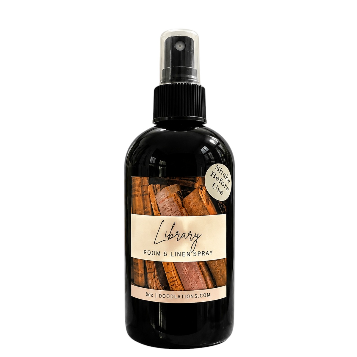 Doodlations Coffee Bar & Boutique Library room and linen spray in an 8oz black bottle with a vintage book label