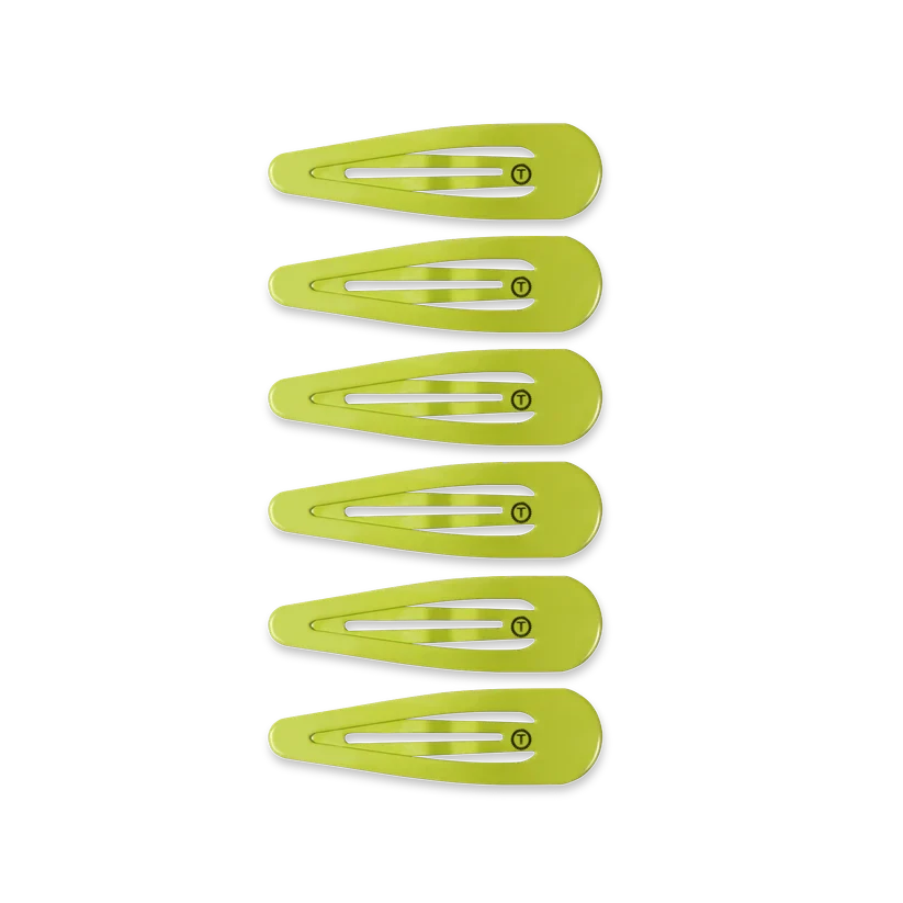 Six lime green TELETIES Snap Clip hair clips arranged vertically against a black background.