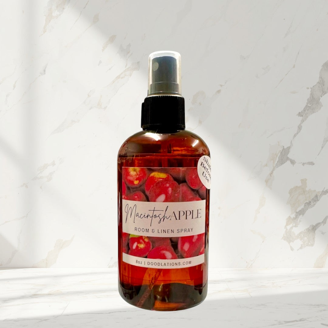 Doodlations Coffee Bar & Boutique Macintosh Apple room and linen spray in amber bottle with apples on label. 8oz.