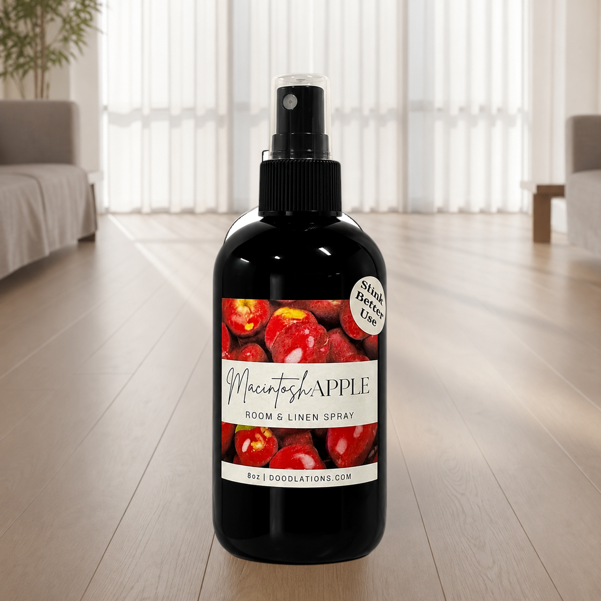 Doodlations Coffee Bar & Boutique Macintosh Apple room and linen spray in a black bottle with a red apple label