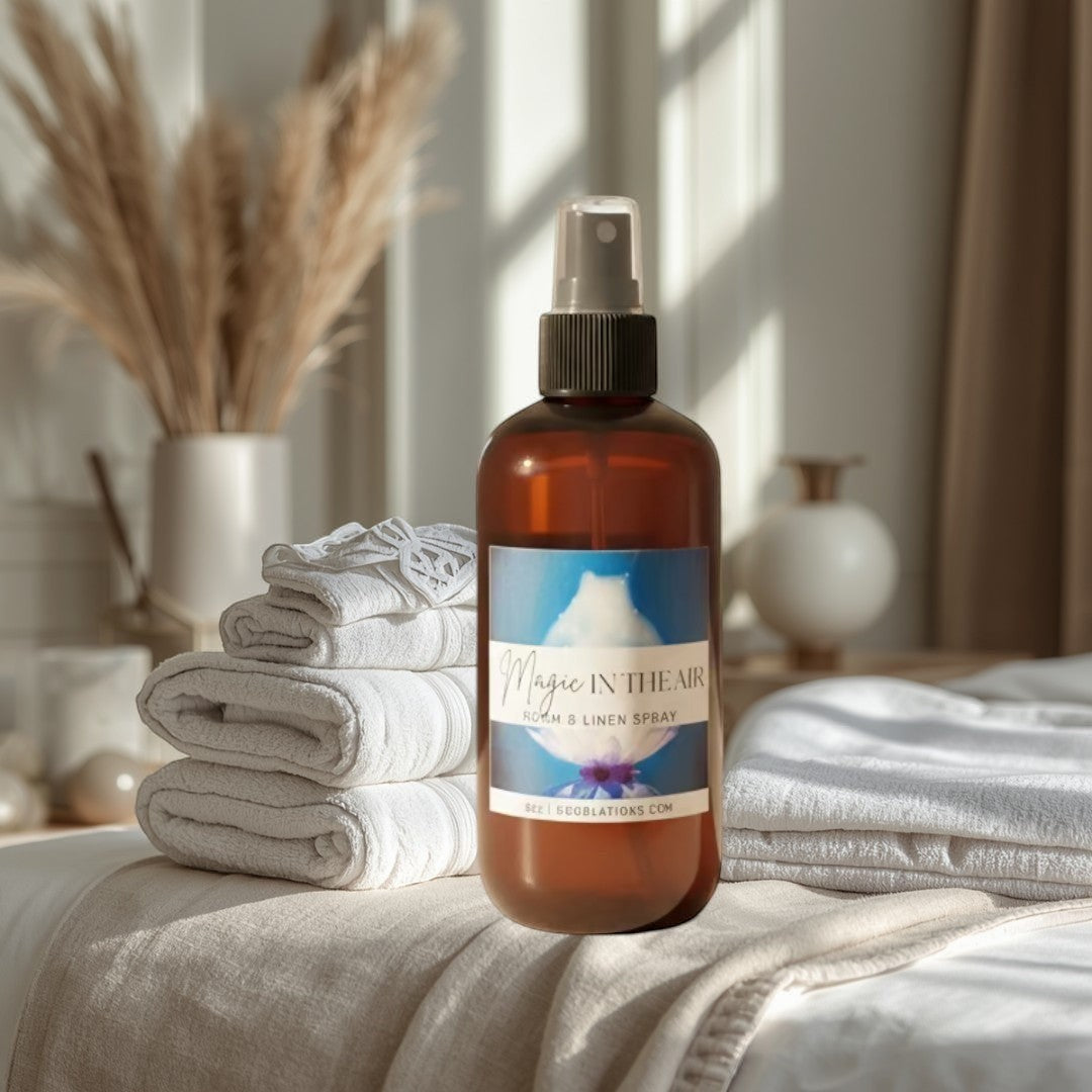 Doodlations Magic in the Air Room & Linen Spray in amber bottle with blue label.