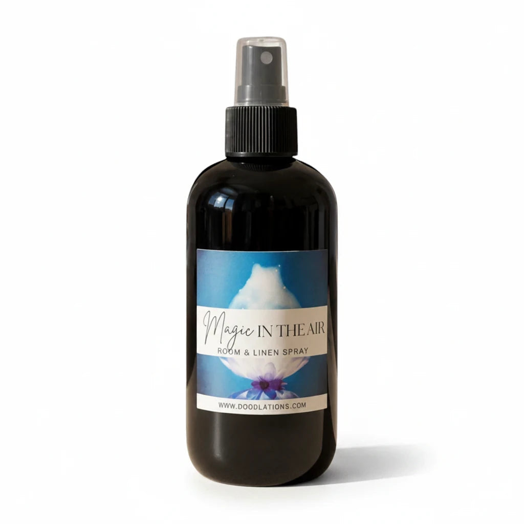Doodlations Coffee Bar & Boutique Magic in the Air room and linen spray in a black bottle with a floral label