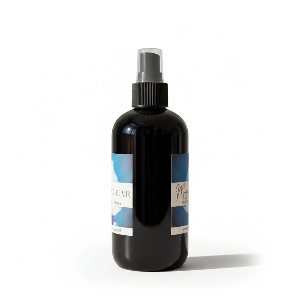 Doodlations Coffee Bar & Boutique Magic in the Air luxury room and linen spray in a black bottle with a spray nozzle.