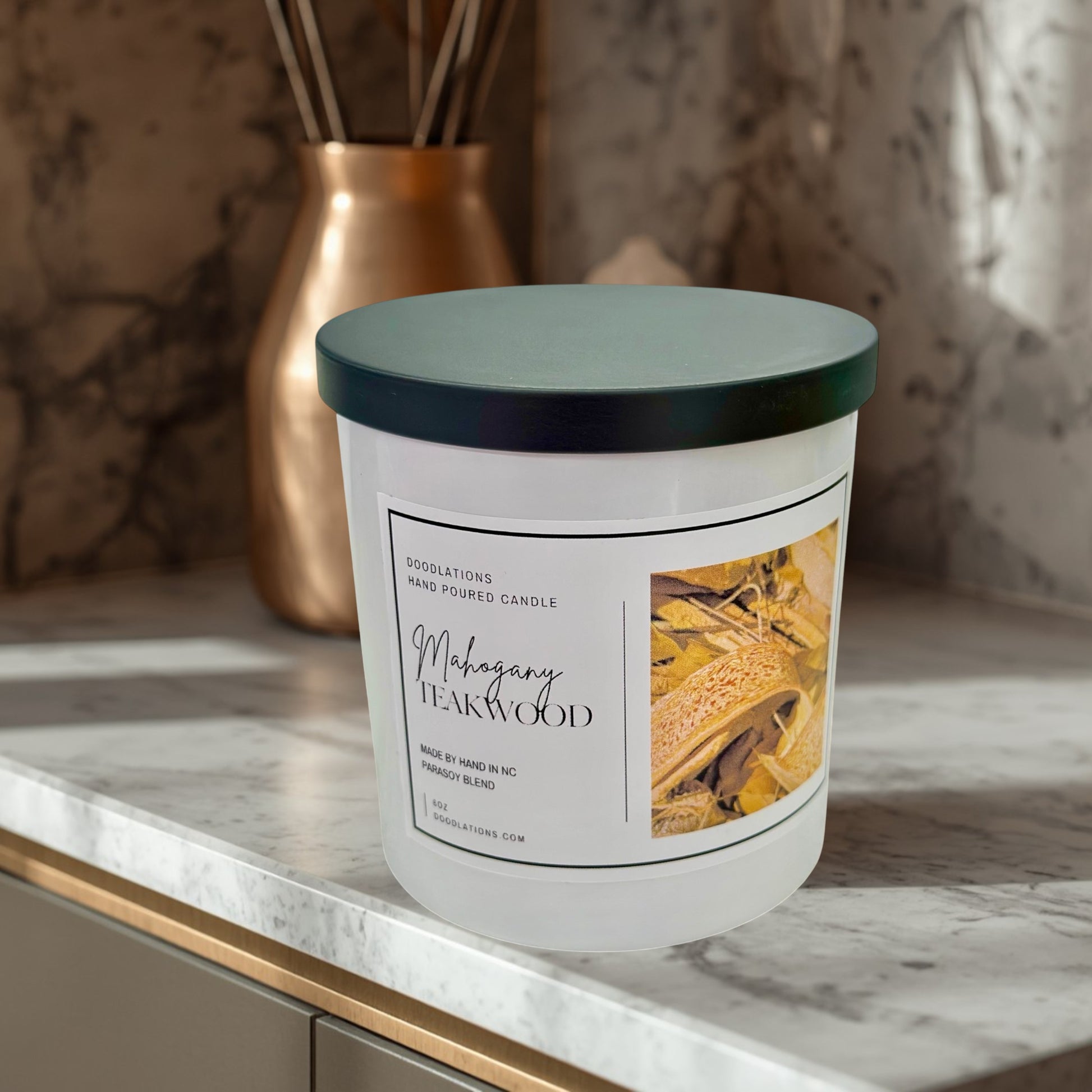 Doodlations Coffee Bar & Boutique Mahogany Teakwood hand-poured 8oz candle with a warm woodsy scent.