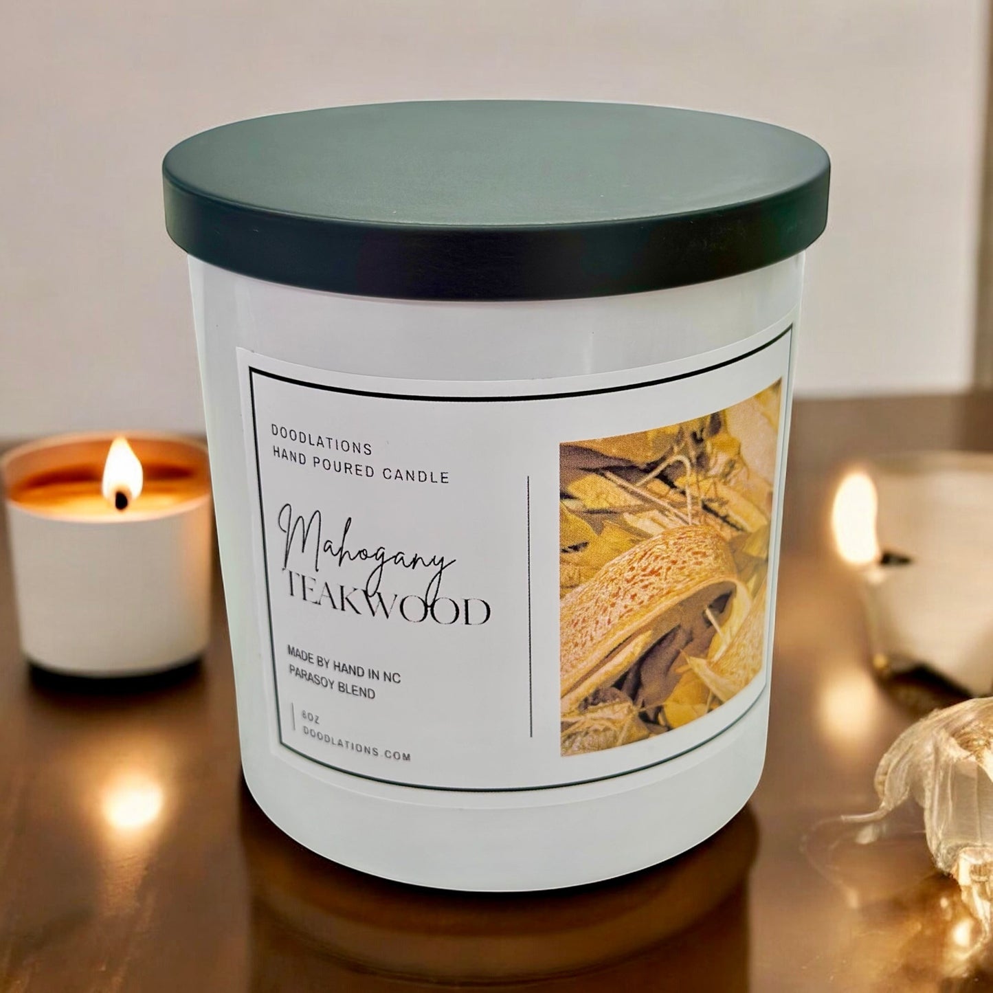 Doodlations Coffee Bar & Boutique Mahogany Teakwood hand-poured 8oz candle with a warm woodsy scent.