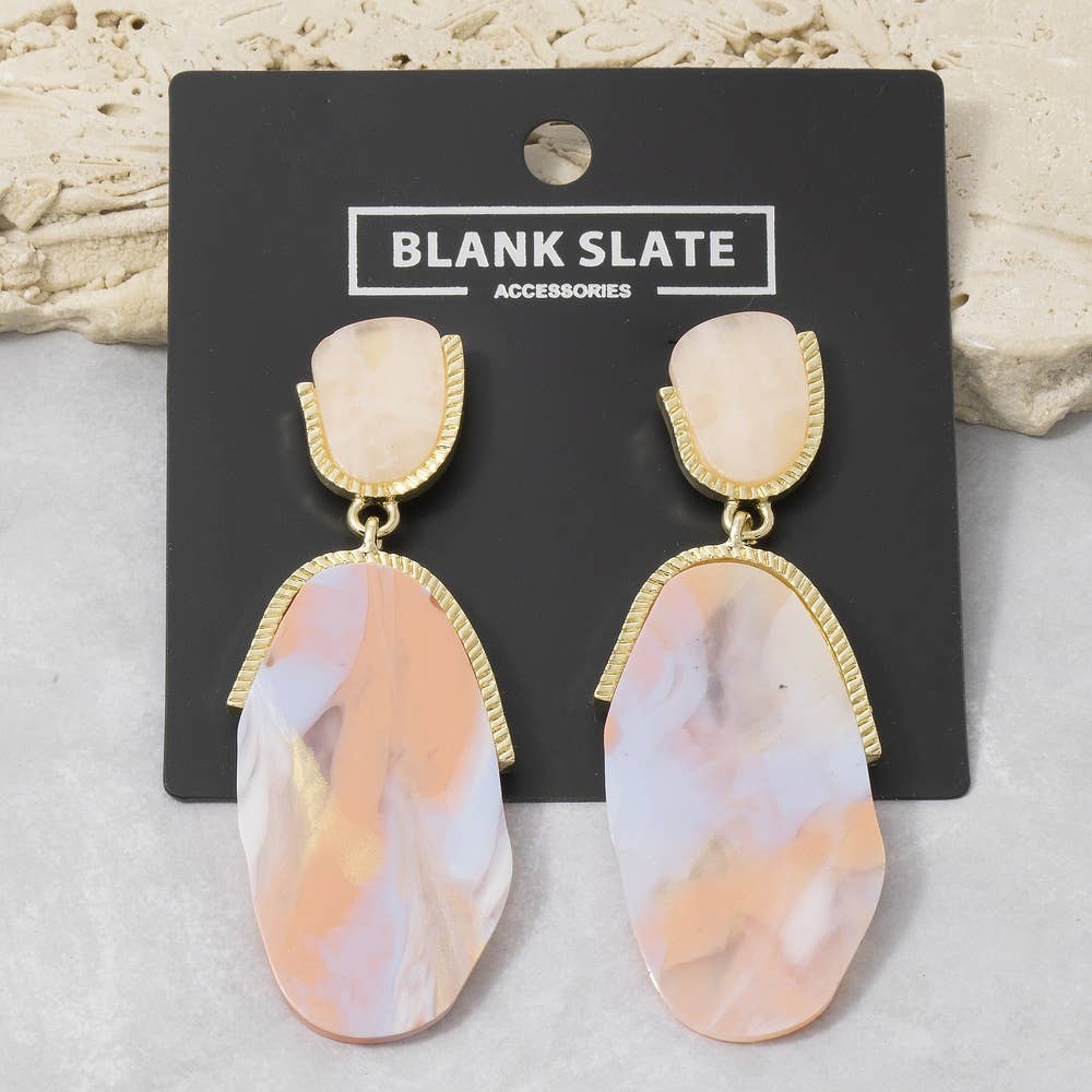 Doodlations Coffee Bar & Boutique marble teardrop earrings with gold-tone metal accents on a display card