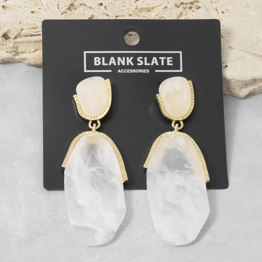 Doodlations Coffee Bar & Boutique marble resin teardrop earrings with gold-tone metal accents on a display card.