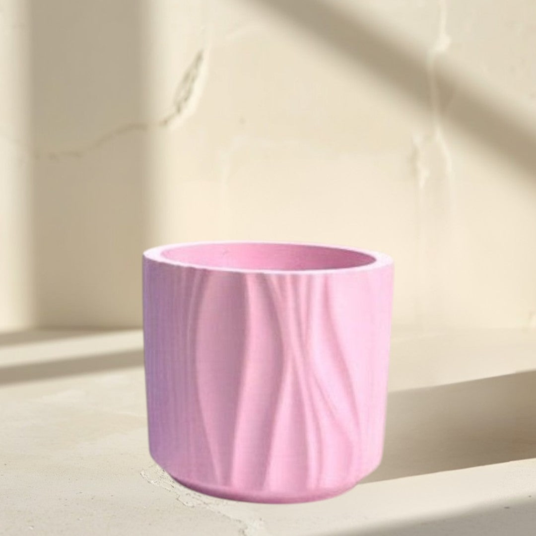 Doodlations Coffee Bar & Boutique Darlin Days marbled concrete candle in blue and pink wavy textured vessels.