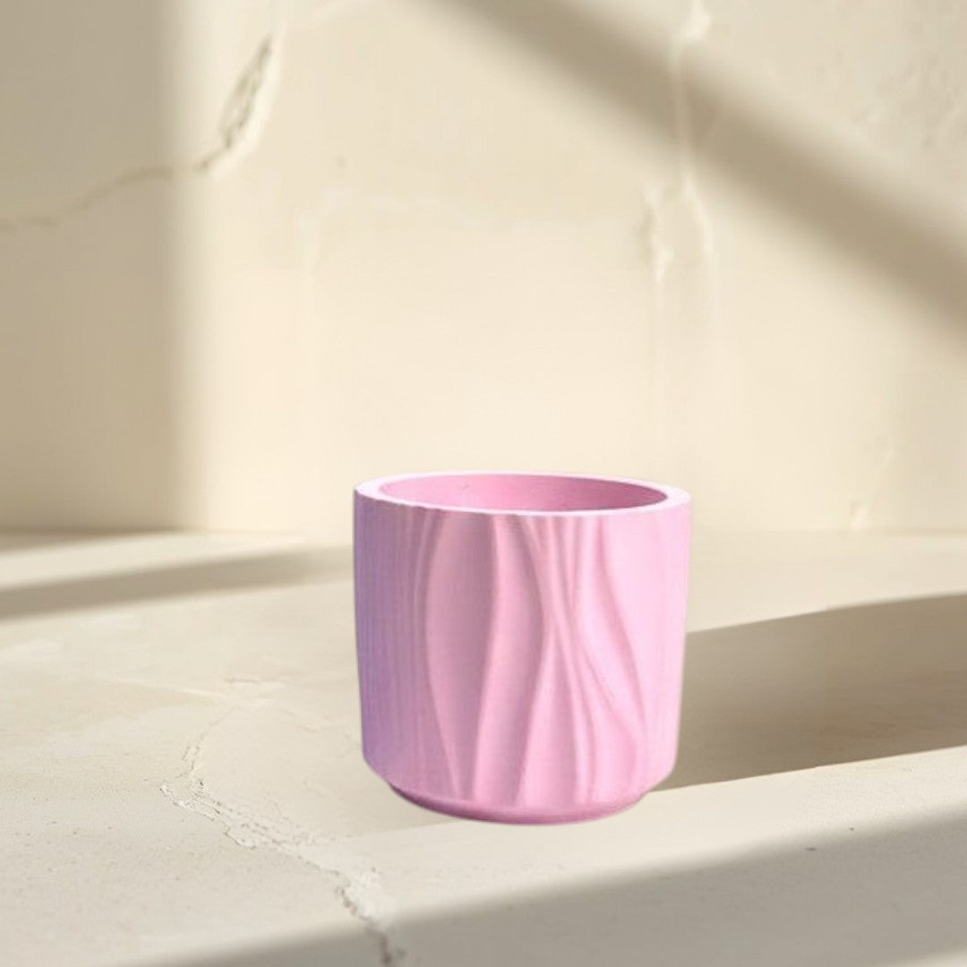 Doodlations Coffee Bar & Boutique Darlin Days marbled concrete candle in blue and pink wavy textured vessels.