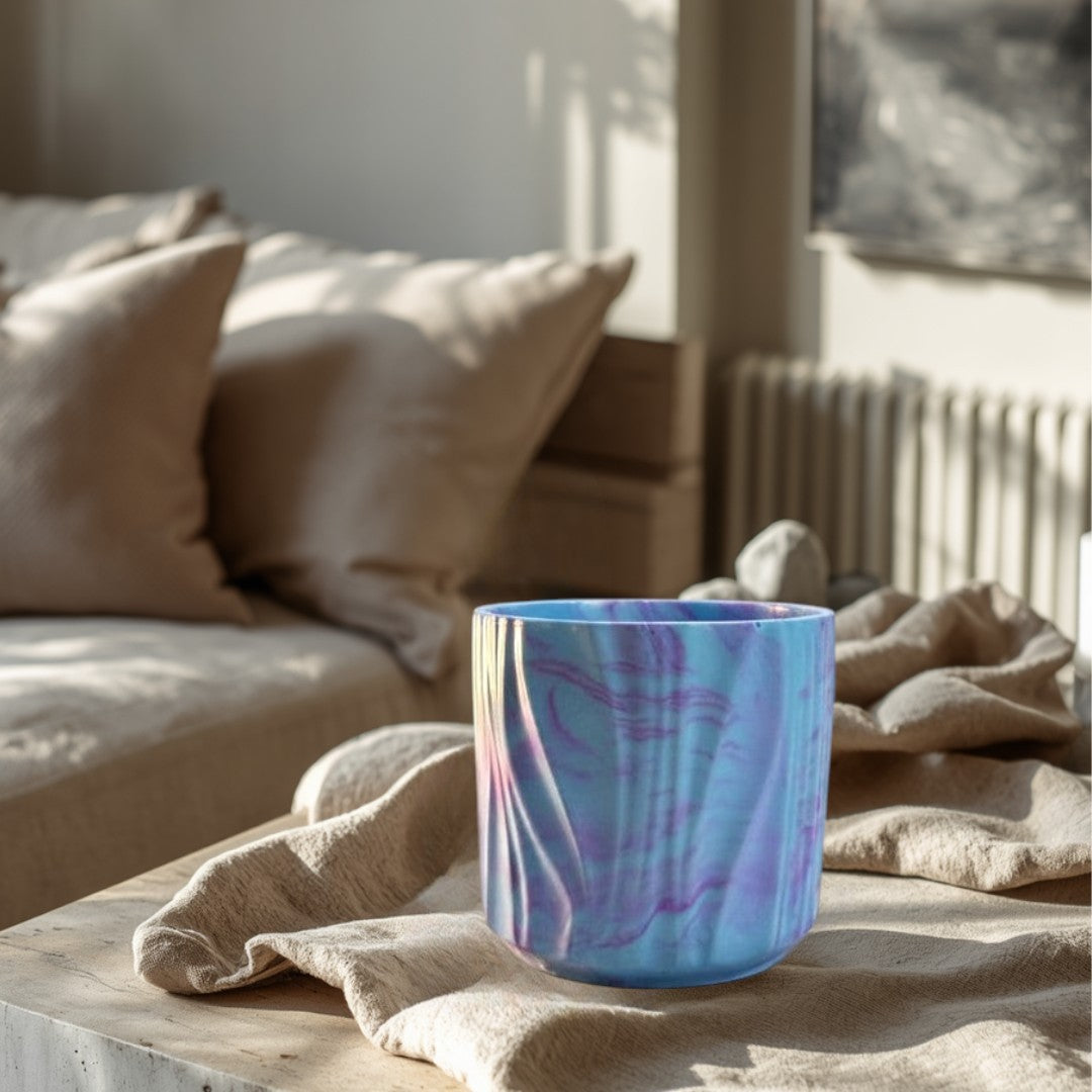 Doodlations Coffee Bar & Boutique marbled concrete candle in blue and purple with a wavy texture. 4oz soy blend wax.