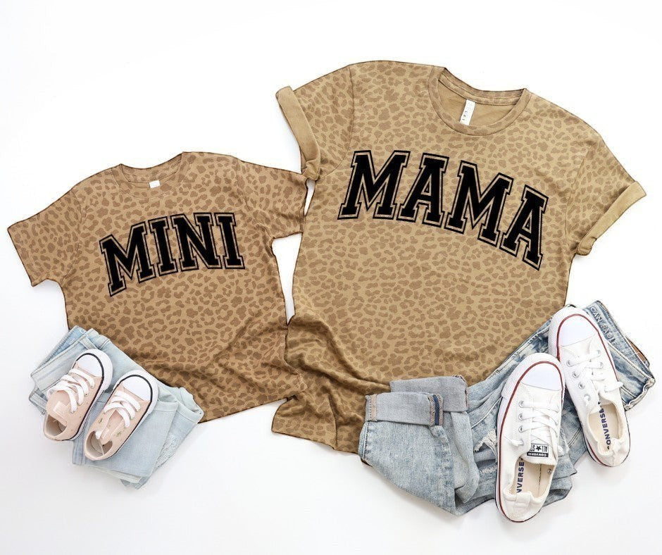Doodlations Coffee Bar & Boutique matching leopard print cotton t-shirts for mama and mini with black varsity text.