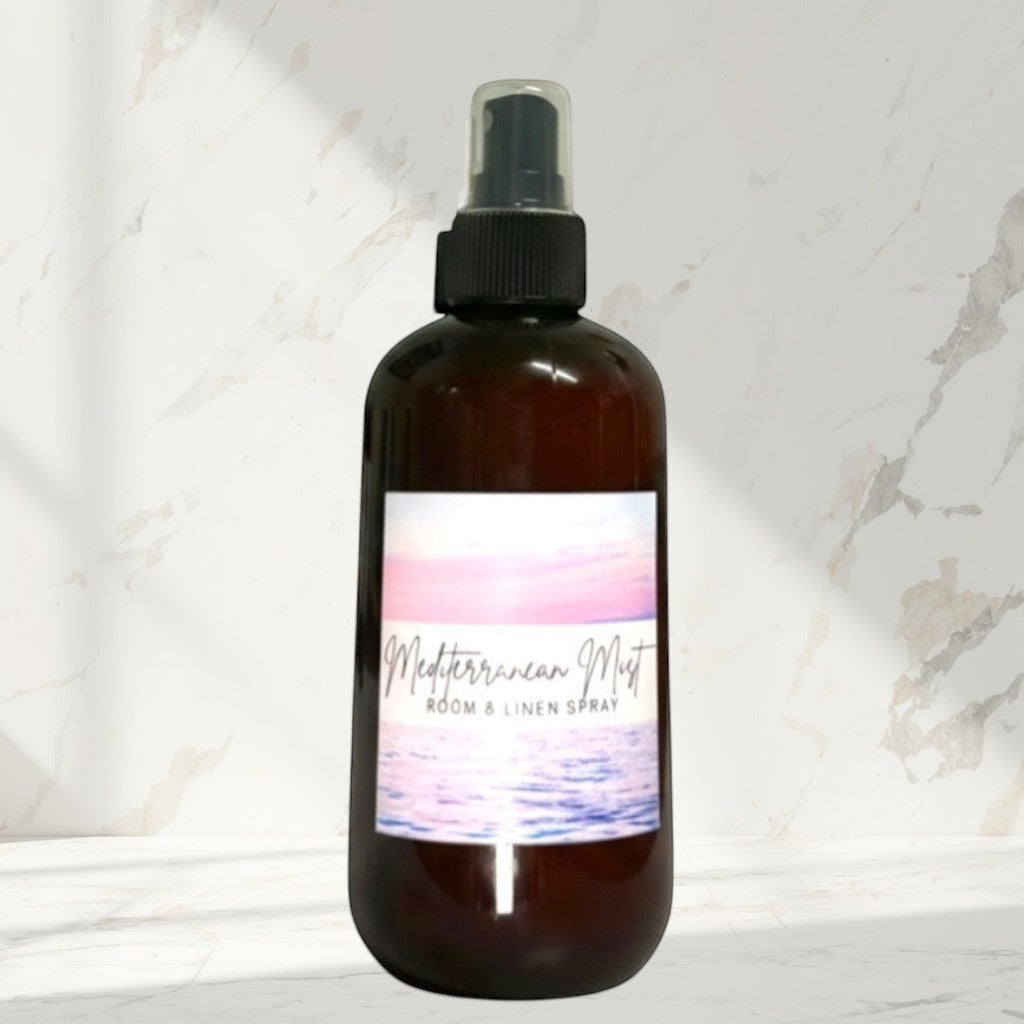 Doodlations Coffee Bar & Boutique Mediterranean Mist room and linen spray in amber bottle with ocean sunset label.
