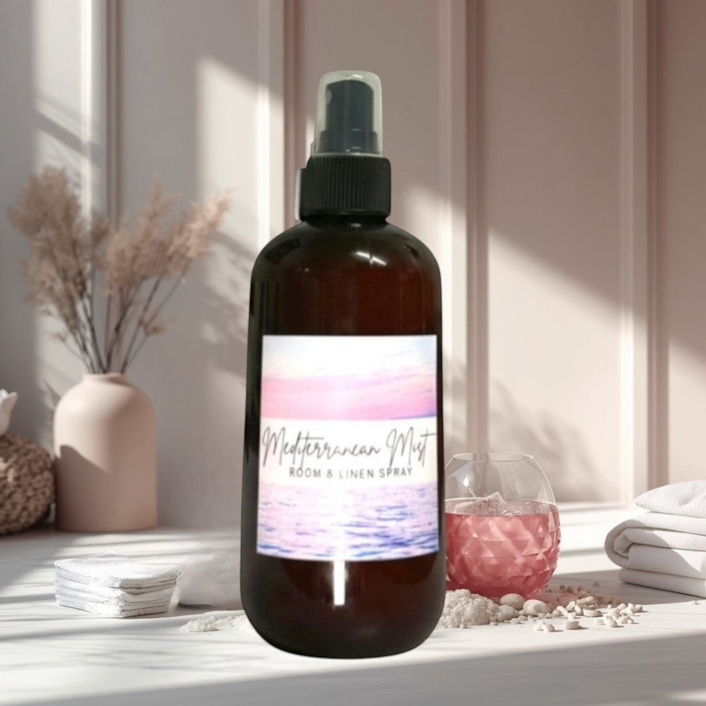 Doodlations Coffee Bar & Boutique Mediterranean Mist room and linen spray in amber bottle with ocean sunset label.