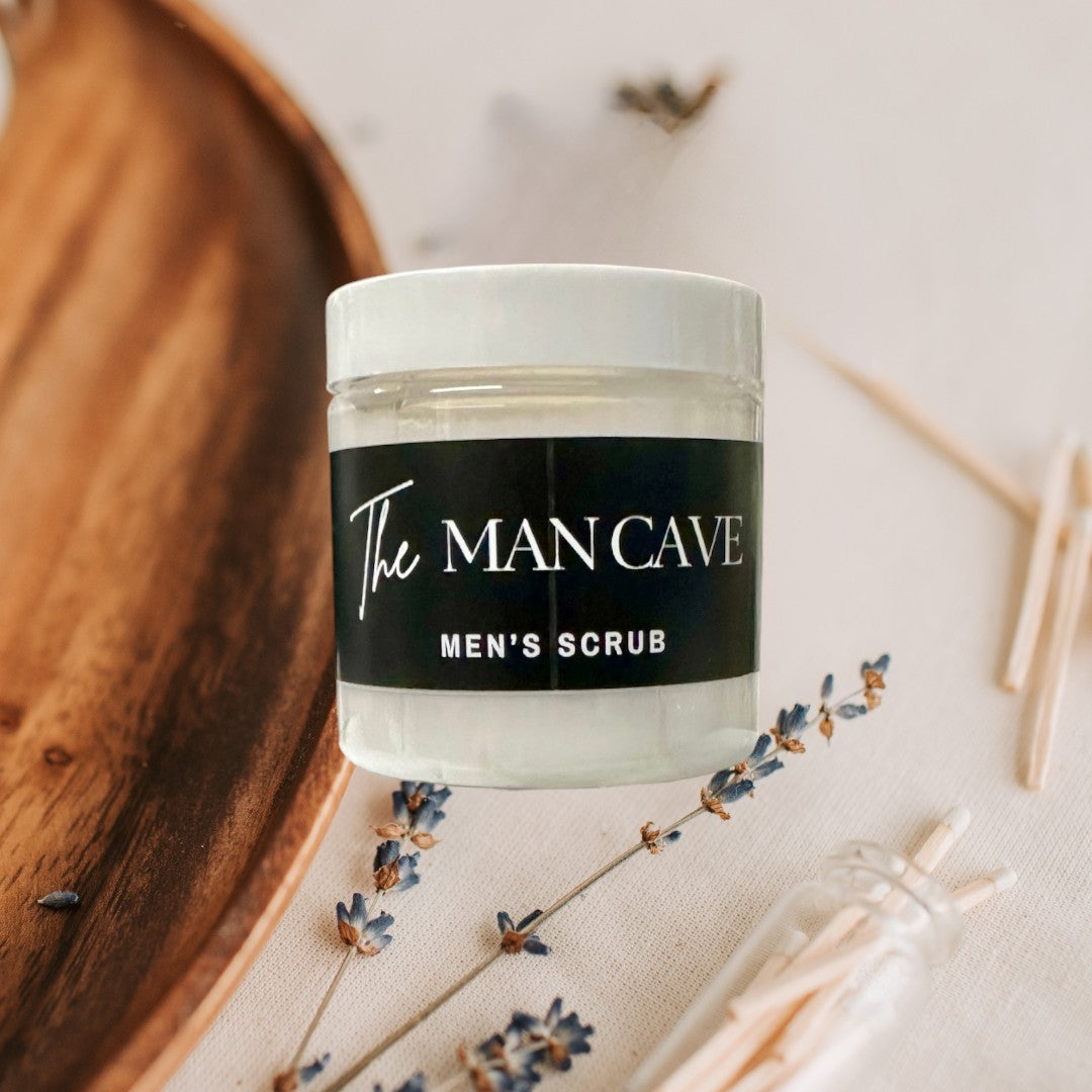 Doodlations Coffee Bar & Boutique The Man Cave Men's Scrub, 4 oz jars stacked, white whipped soap with black label.
