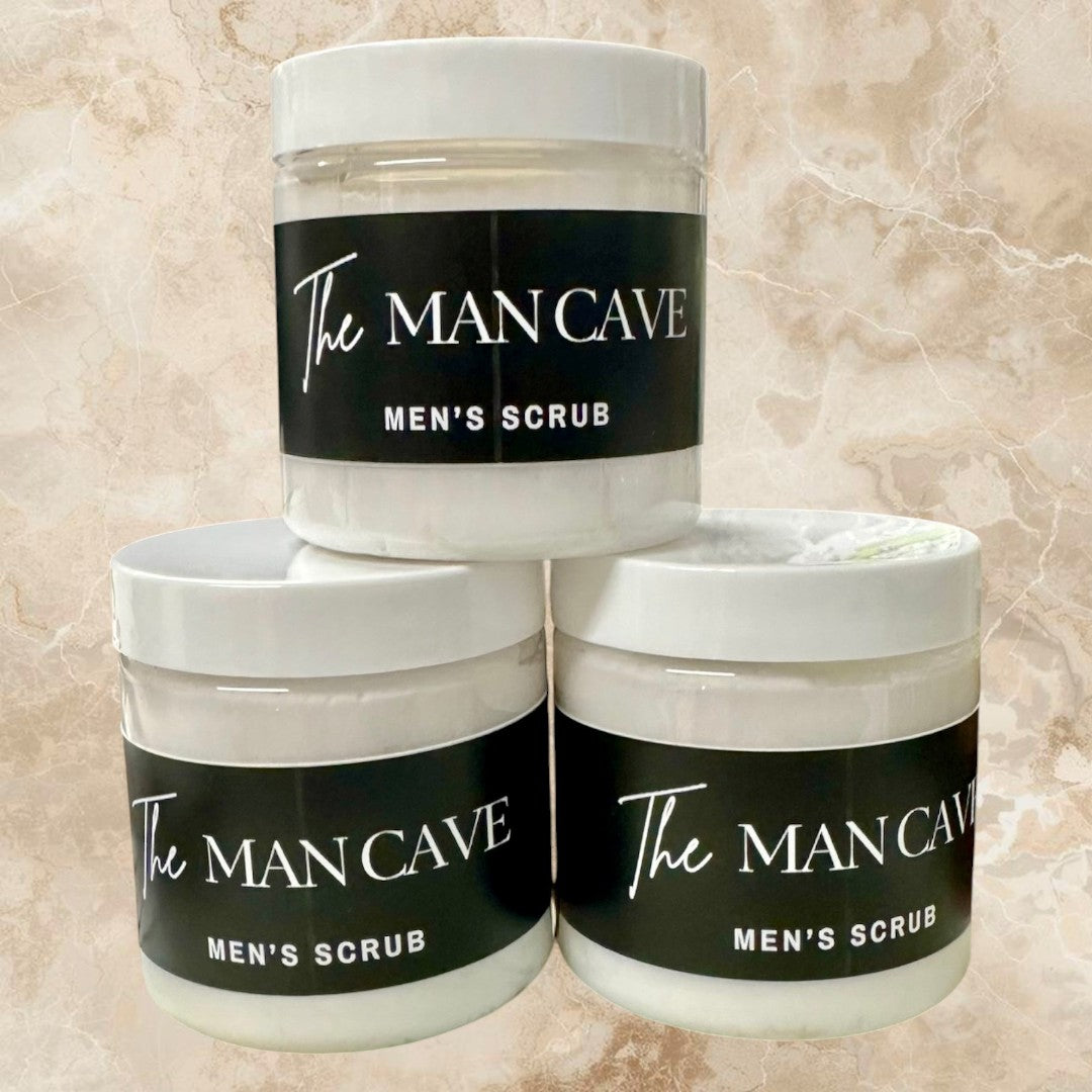 Doodlations Coffee Bar & Boutique The Man Cave Men's Scrub in white jar with black label