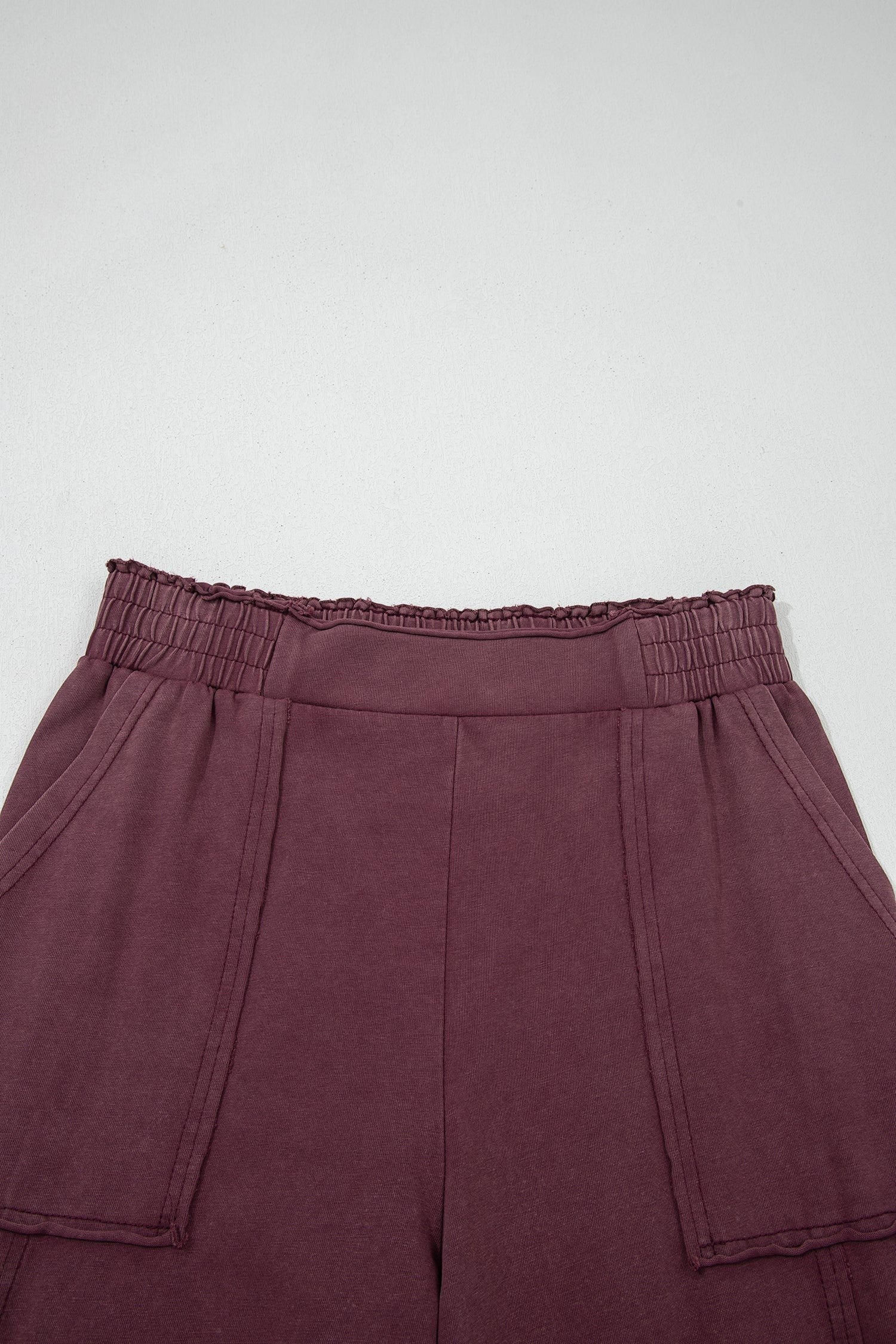 Doodlations Coffee Bar & Boutique merlot mineral wash cargo sweatpants with an elastic waist and raw seam detailing.