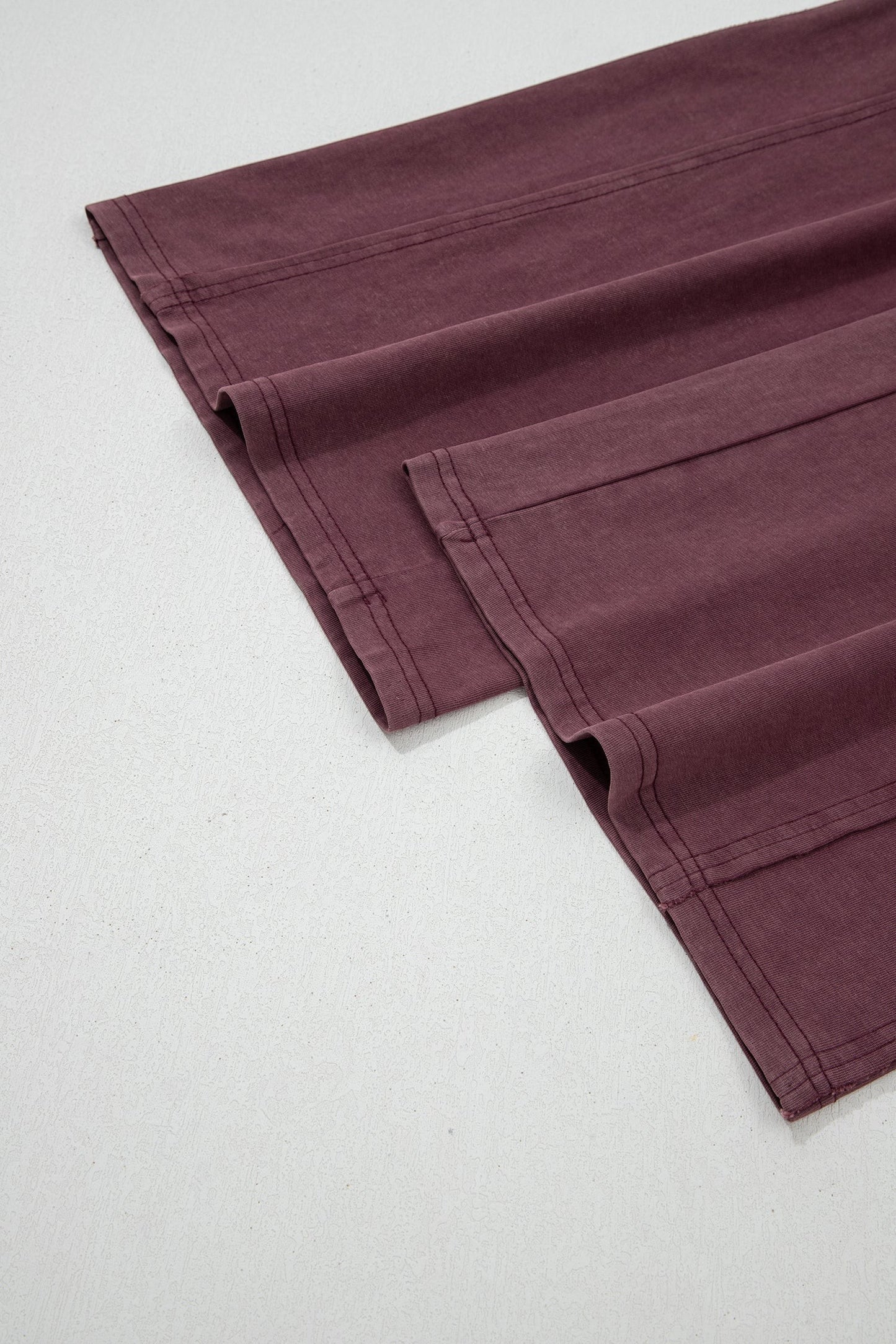 Doodlations Coffee Bar & Boutique merlot mineral wash cargo sweatpants featuring raw seam details and barrel leg fit.
