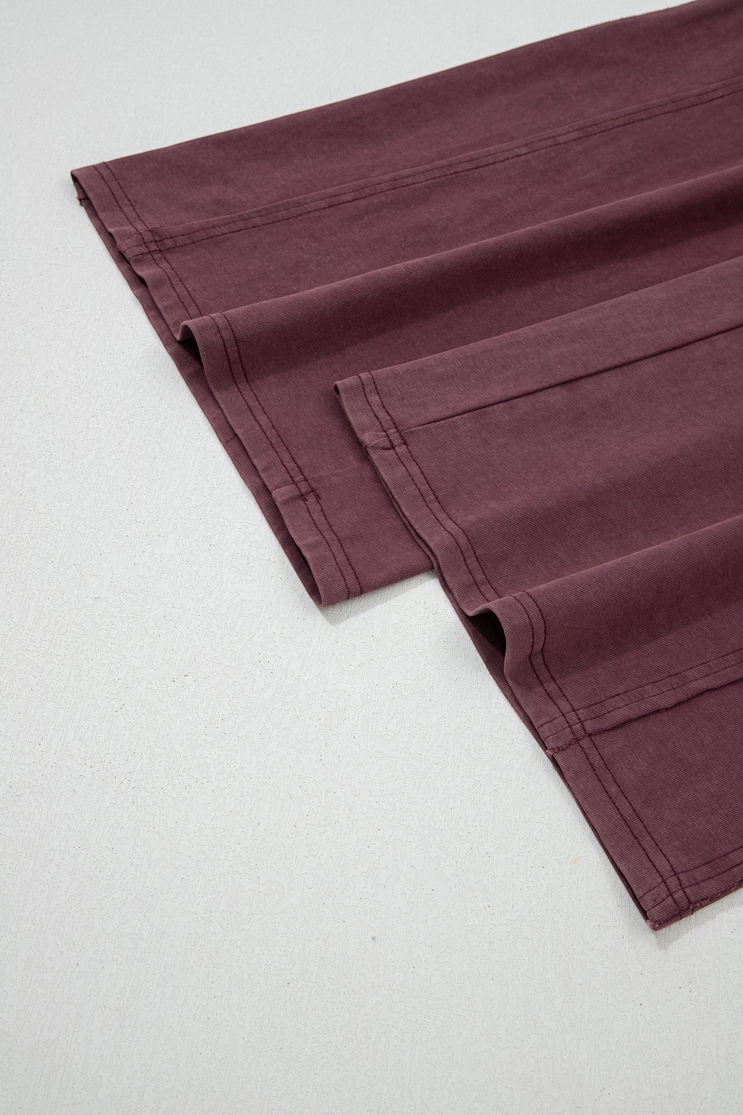 Doodlations Coffee Bar & Boutique merlot mineral wash cargo sweatpants featuring raw seam details and barrel leg fit.