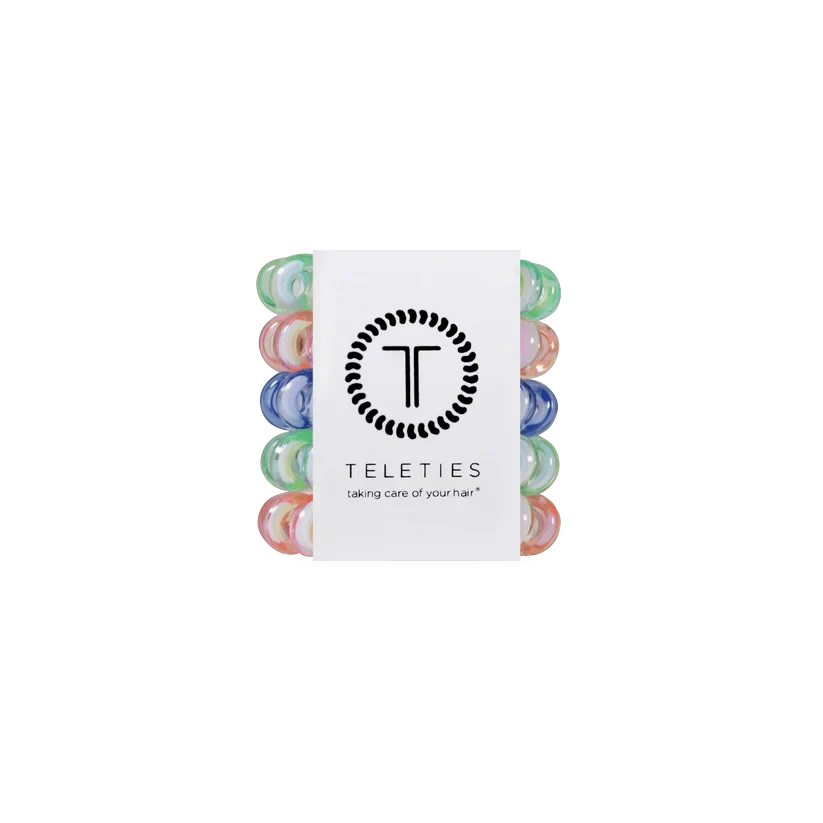Doodlations Coffee Bar & Boutique Shades of Summer mini coil hair ties in pink, green, and blue on a display card.