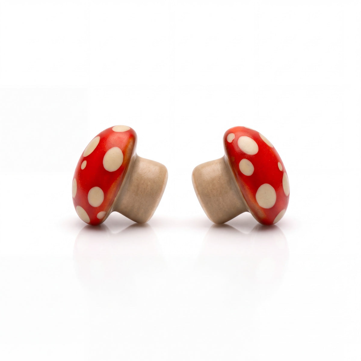 Doodlations Coffee Bar & Boutique handmade red and white mushroom stud earrings with titanium posts.