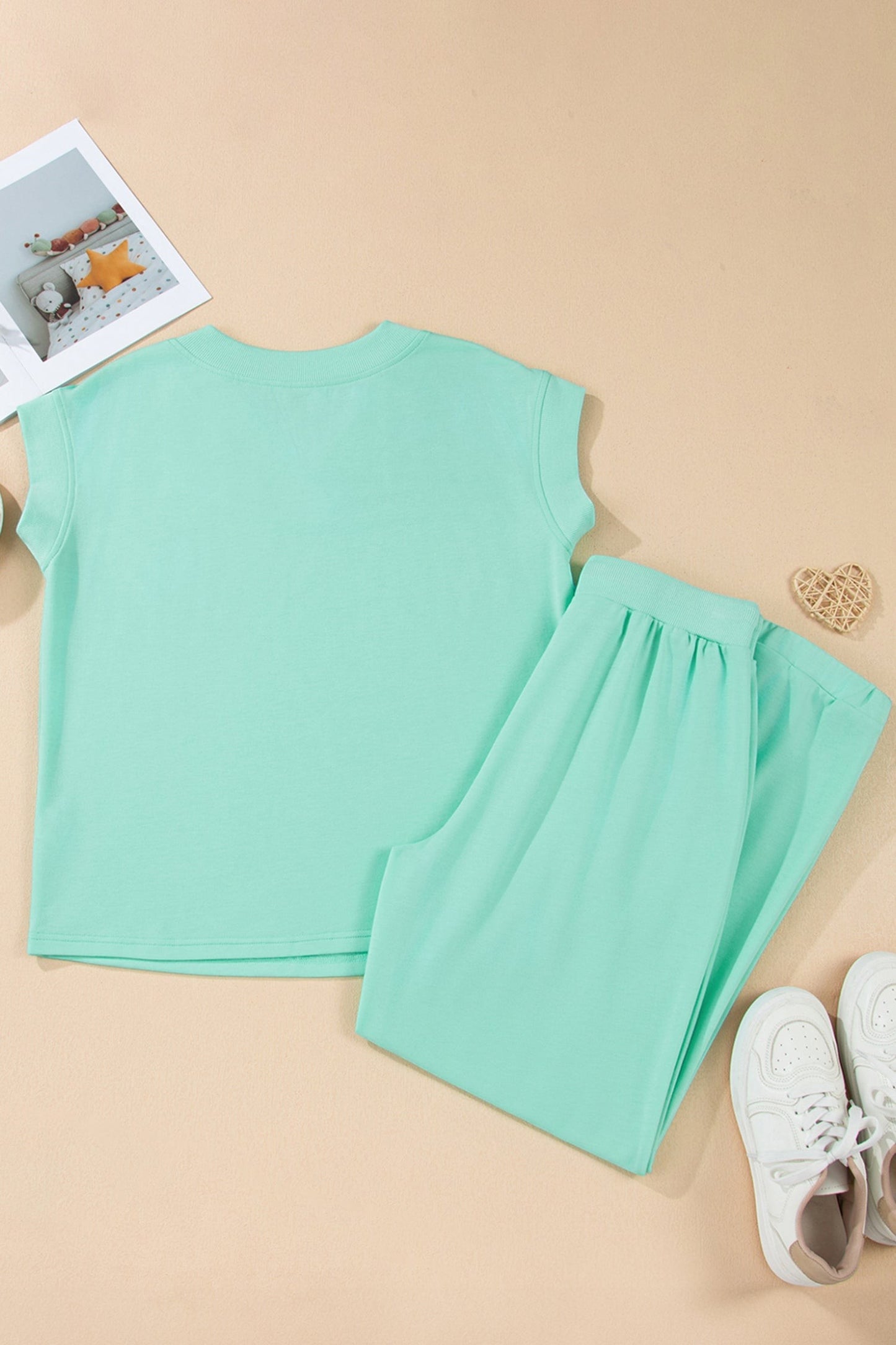Doodlations Coffee Bar & Boutique mint green two-piece lounge set with V-neck top and drawstring pants.