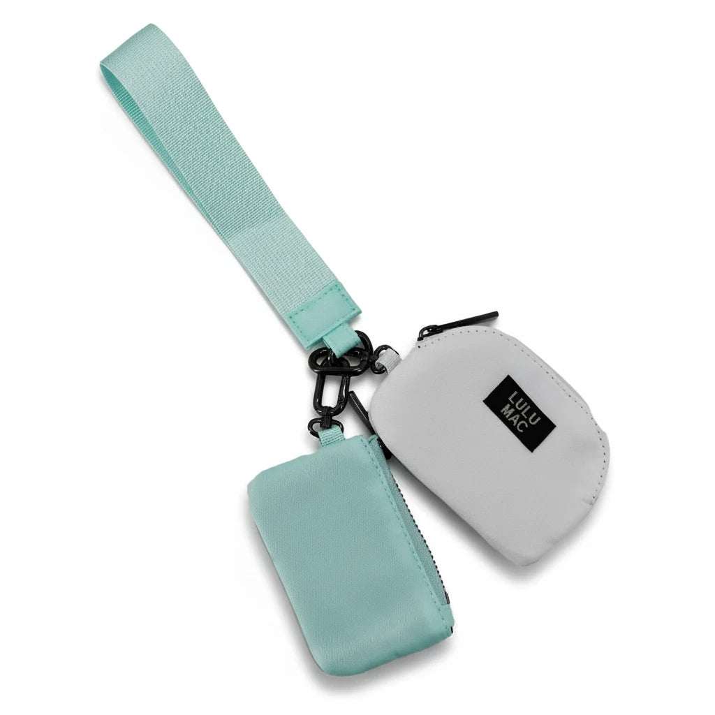 Doodlations Coffee Bar & Boutique Lulu Mac double pouch wristlet in mint and white with a matching wrist strap.
