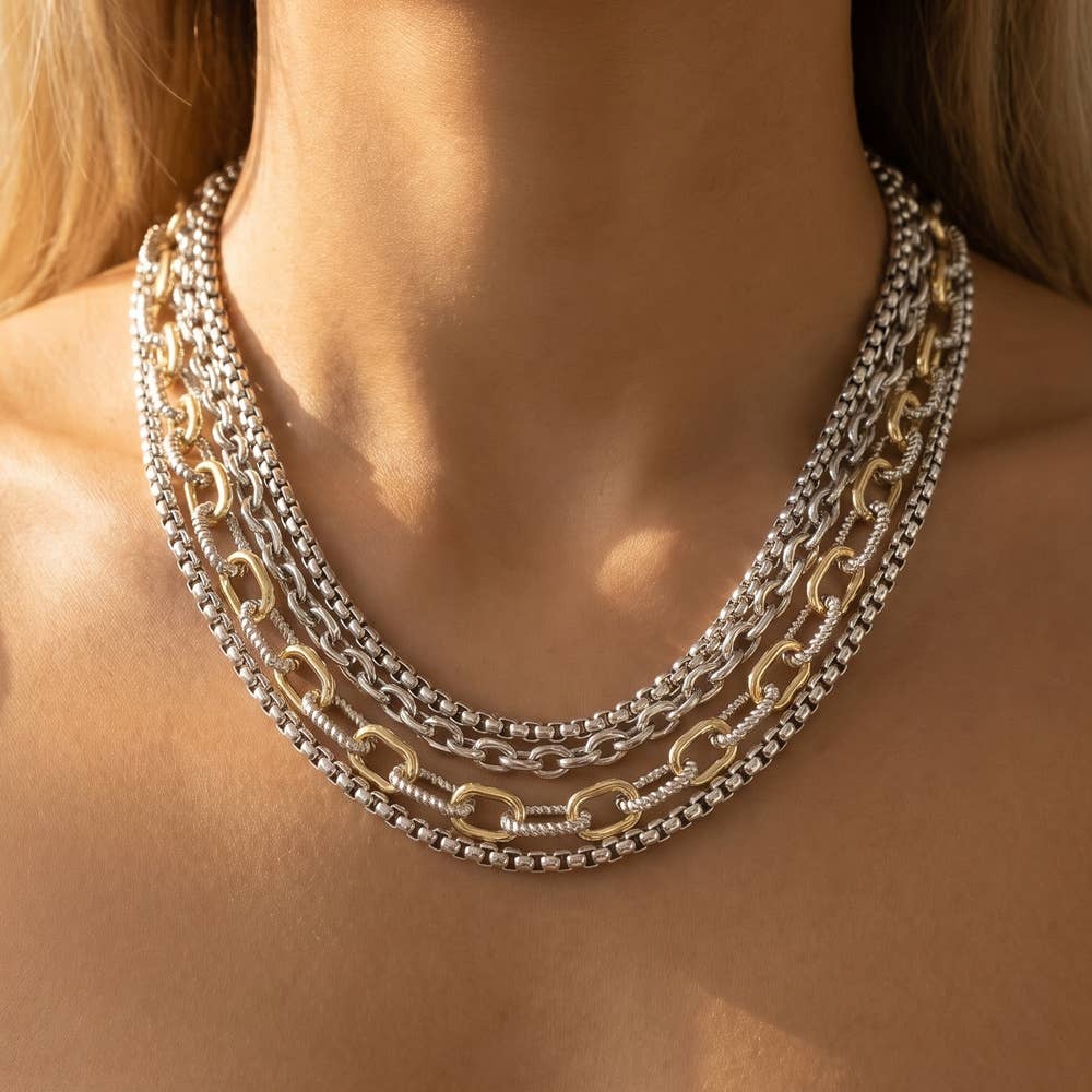 Doodlations Coffee Bar & Boutique layered multi-strand necklace featuring mixed silver and gold-tone chain links.