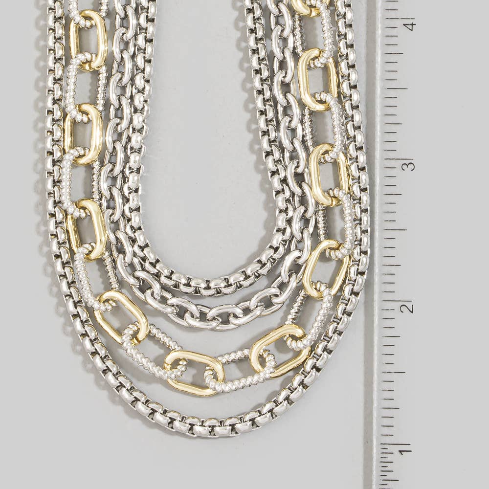 Doodlations Coffee Bar & Boutique layered multi-strand necklace with mixed silver and gold-tone chain links.