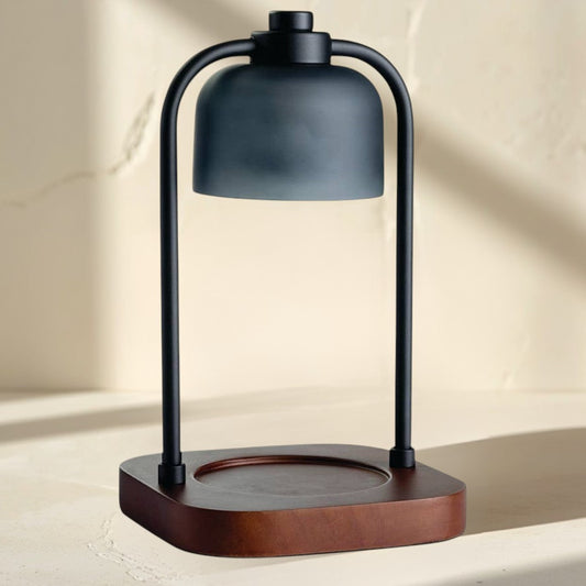 Doodlations Coffee Bar & Boutique modern candle warmer lamp with dark metal frame and wood base.