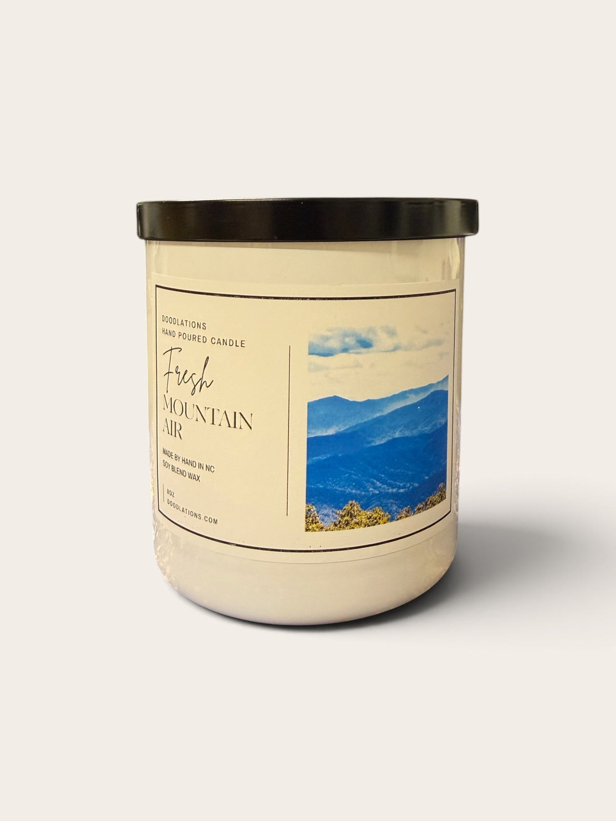 Doodlations Coffee Bar & Boutique Fresh Mountain Air luxury hand-poured soy blend candle in a glass jar with black lid