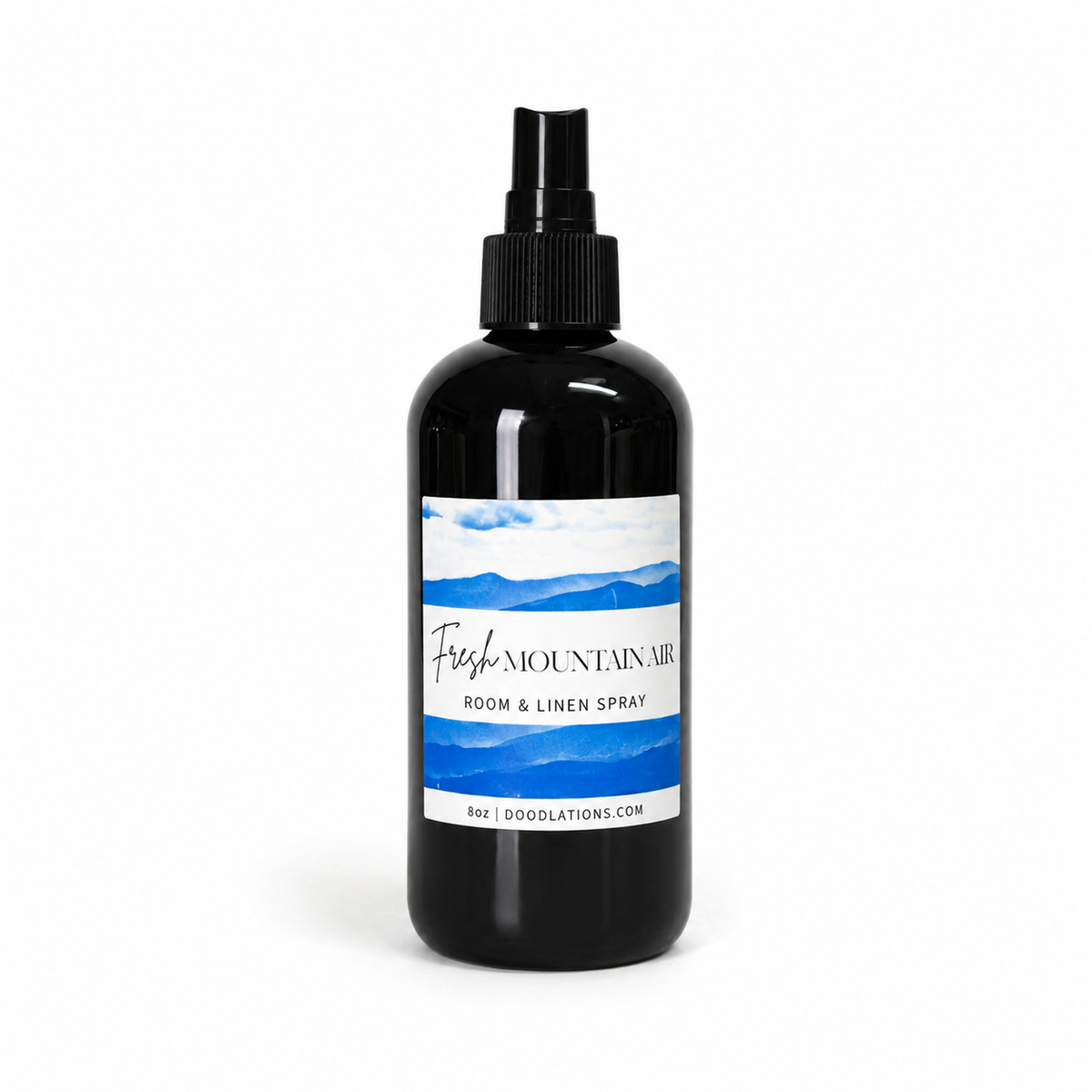 Doodlations Coffee Bar & Boutique Fresh Mountain Air room and linen spray in a black bottle with a mountain label.