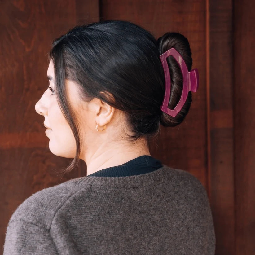 Doodlations Coffee Bar & Boutique Teleties mulberry open claw hair clip worn by a woman in a half-up hairstyle
