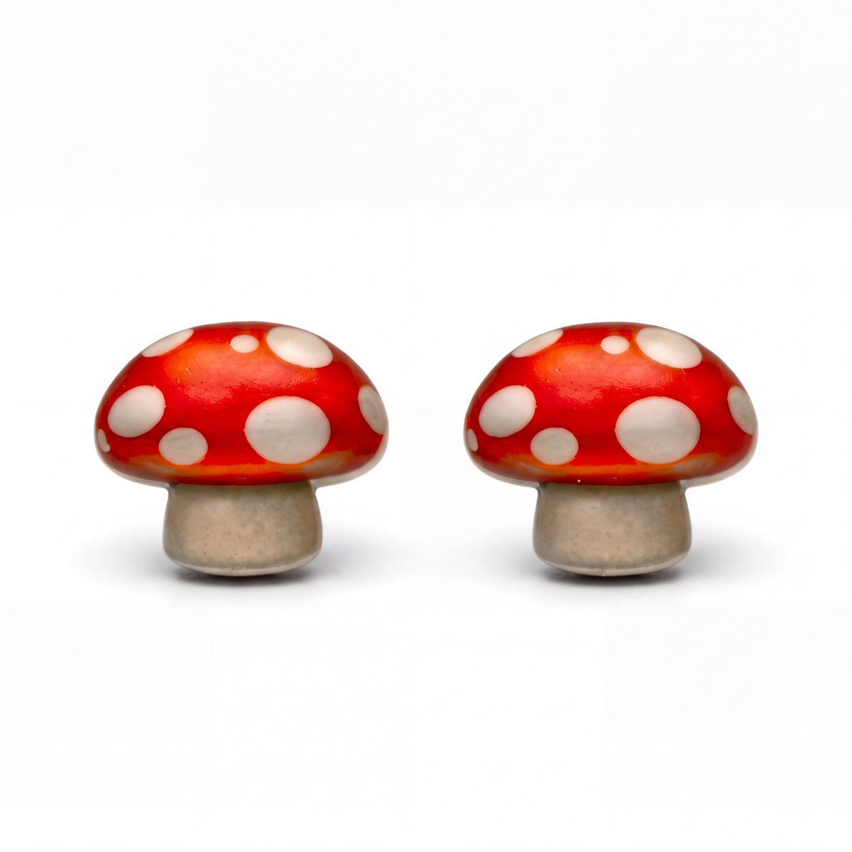 Doodlations Coffee Bar & Boutique handmade red and white mushroom stud earrings with titanium posts.