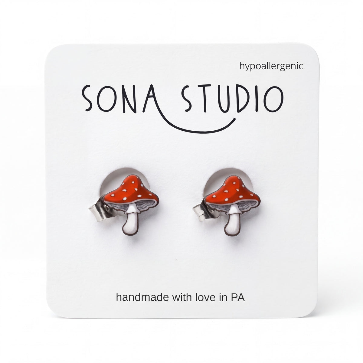 Doodlations Coffee Bar & Boutique handmade red and white mushroom stud earrings with hypoallergenic titanium posts.