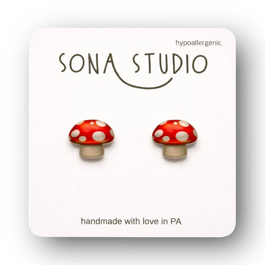 Doodlations Coffee Bar & Boutique handmade red and white mushroom stud earrings with hypoallergenic titanium posts.