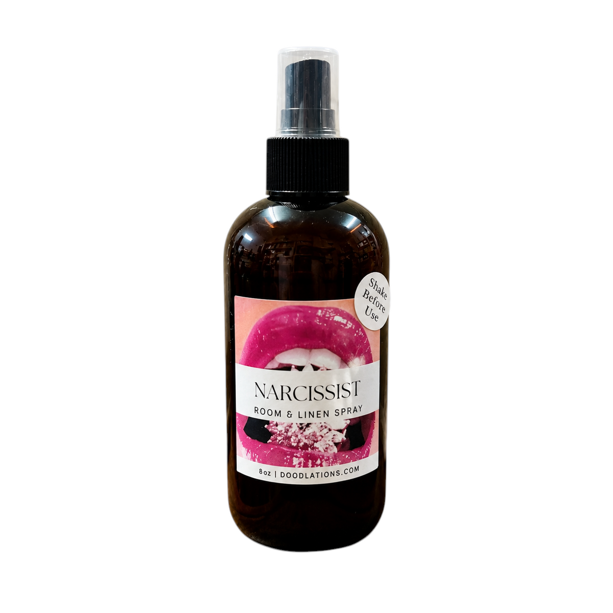 Doodlations Coffee Bar & Boutique Narcissist room and linen spray in an 8oz amber bottle with a pink lip label.