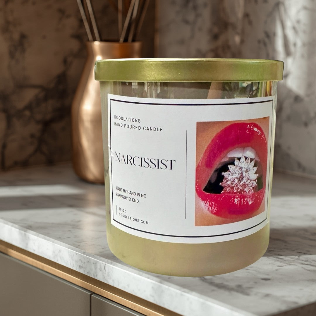 Doodlations Coffee Bar & Boutique Narcissist luxury hand-poured soy blend candle with a bold floral-fruity scent.