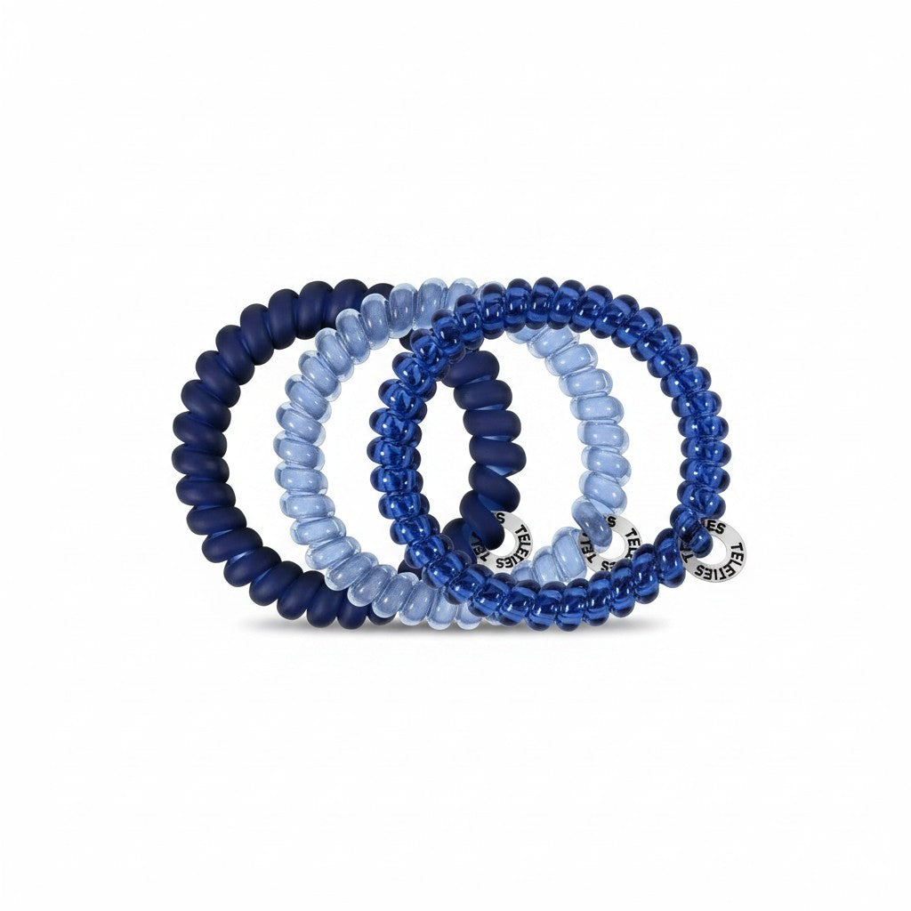 Doodlations Coffee Bar & Boutique Nightfall Navy spiral hair ties in various shades of blue for a damage-free hold.