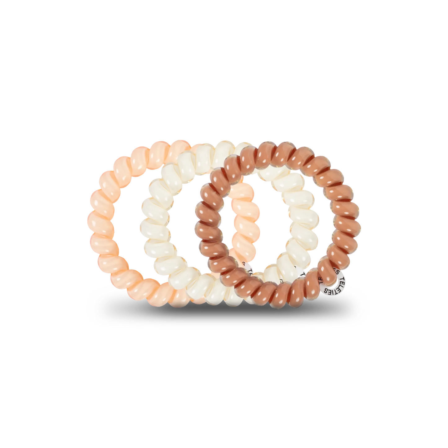 Doodlations Coffee Bar & Boutique For the Love of Nudes spiral hair ties in assorted beige and brown shades.