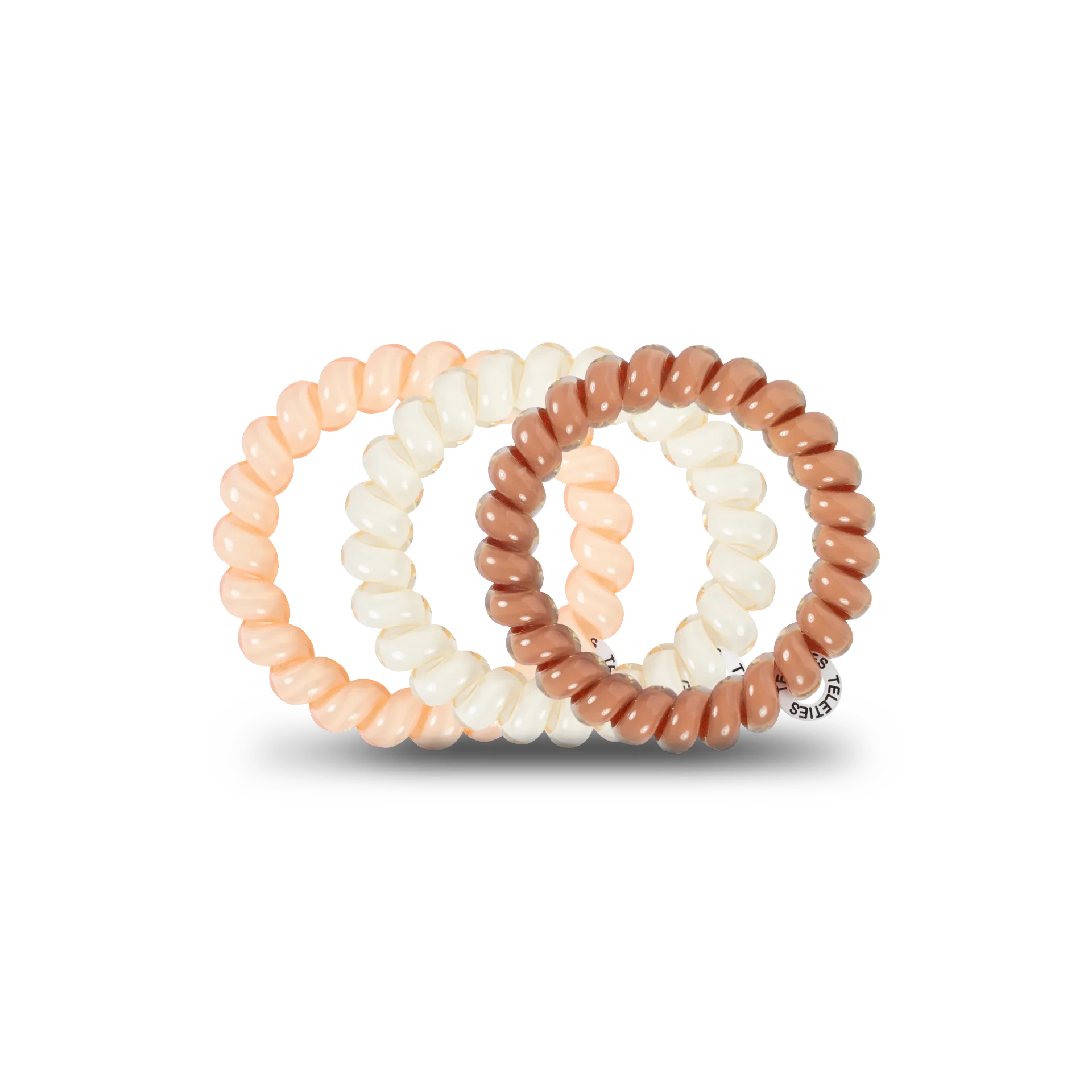 Doodlations Coffee Bar & Boutique For the Love of Nudes spiral hair ties in assorted beige and brown shades.