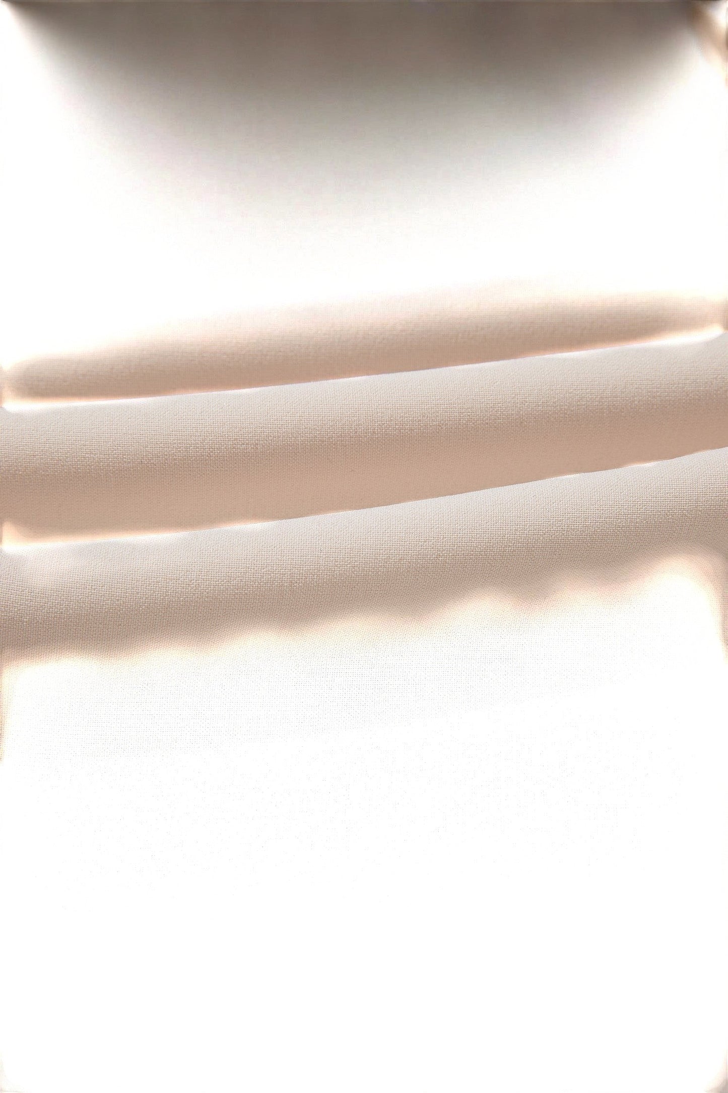 Doodlations Coffee Bar & Boutique oatmeal fabric texture of a long sleeve blouse with soft folds