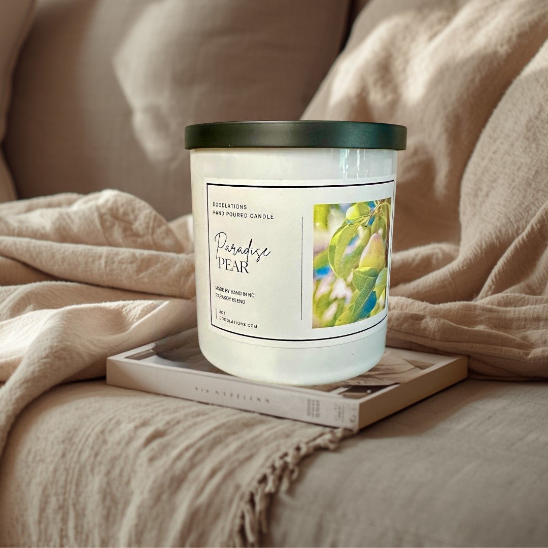 Doodlations Coffee Bar & Boutique Paradise Pear hand-poured para-soy blend candle with tropical fruit and floral scent.