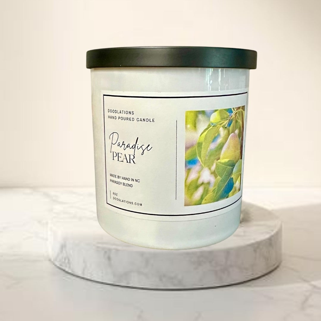 Doodlations Coffee Bar & Boutique Paradise Pear hand-poured para-soy blend candle with tropical fruit and floral scent.