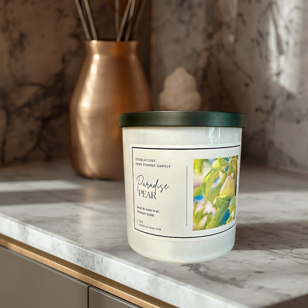 Doodlations Coffee Bar & Boutique Paradise Pear hand-poured para-soy blend candle with tropical fruit and floral scent.
